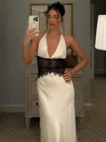 Elegant white dress with black lace for formal events and celebrations.