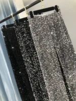 Sequin pants with sparkling silver and black designs, perfect for parties and special events.