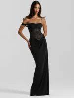 Black lace evening gown with spaghetti straps and floor-length design.