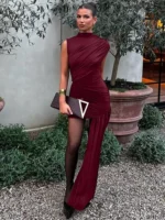 Elegant burgundy dress with asymmetrical design and draped fabric. Perfect for formal events and sty.