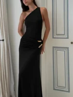 Elegant black evening gown with gold accents, perfect for formal events and special occasions.
