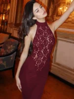 Woman in burgundy lace dress at Thrive Store, stylish fashion.