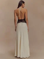 Elegant backless dress with lace accents and halter neck tie, perfect for formal occasions.