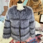 Faux fur coat displayed on a mannequin, perfect for winter fashion.