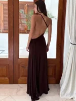 Backless evening gown with spaghetti strap design.