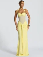 Elegant yellow evening gown with cutout details and flowing skirt for formal occasions.