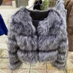 Faux fur coat displayed at Thrive Store, perfect for winter fashion.