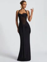 Woman in black evening gown with sheer details, perfect for formal occasions.