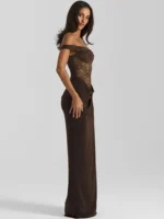 Elegant brown lace evening gown with off-shoulder design and flowing skirt. Perfect for formal event.