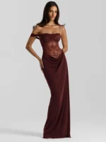 Woman in burgundy lace evening gown, full-length, elegant formal dress.