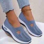 Stylish blue slip-on sneakers with breathable knit fabric and cushioned sole.