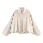 Soft cream oversized jacket with front zipper and dropped shoulder design.