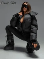 Luxury fashion streetwear, edgy style, oversized puffer jacket, platform boots, model with sunglasses, modern urban look.